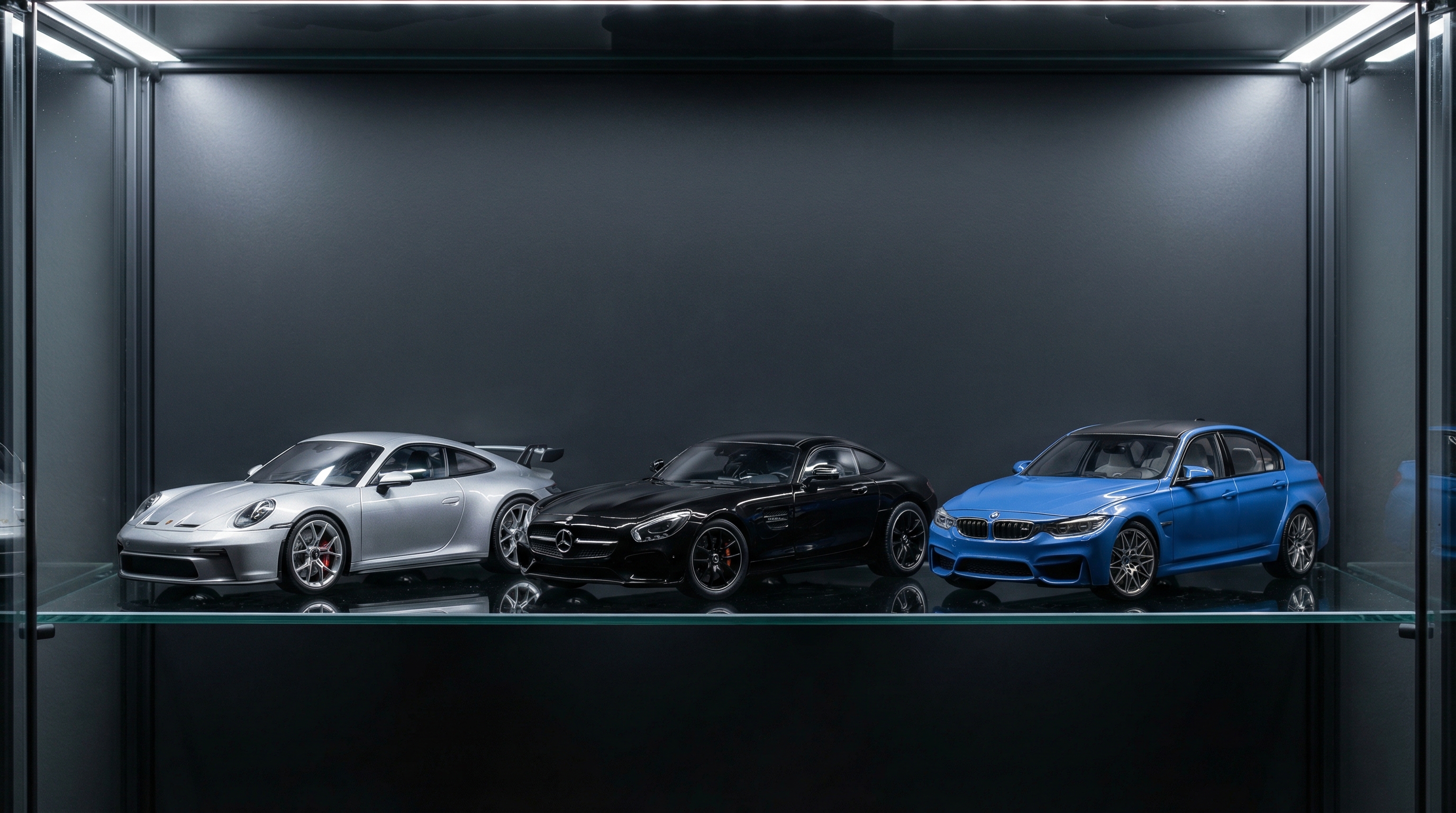 Premium 1:18 scale diecast models of Porsche, Mercedes-Benz, and BMW in glass cabinet
