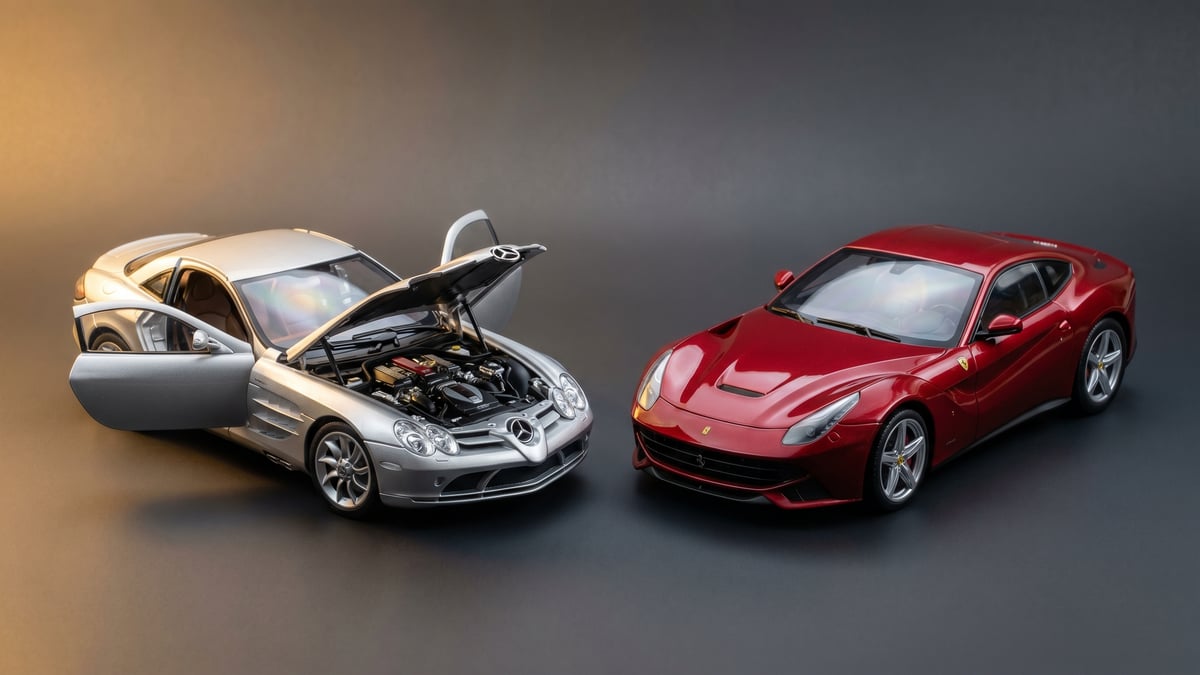 A diecast 1:18 model with an open door beside a sealed resin 1:18 model under studio light