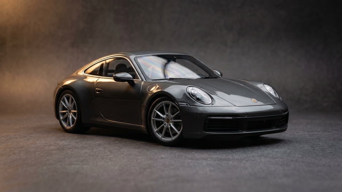 A licensed 1:18 Minichamps model under studio light with crisp panel detail